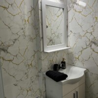Depys Apartment 8 Modern bathroom sink with mirror in stylish apartment bathroom in Kavala