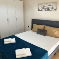 Depys Apartment 1 Modern bedroom with double bed and wardrobe in comfortable apartment in Kavala Greece – KavalaStay accommodation.